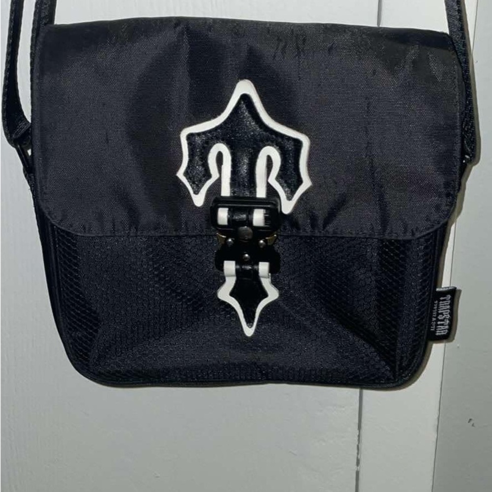 Black Backpack with Durable Fabric and Flap Closure